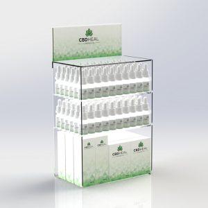 A countertop CBD display unit with an interchangeable graphics trap and different CBD products on display.