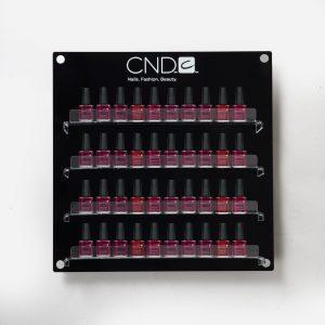 A wall mounted Branded Nail Polish Display with nail vanishes on display.