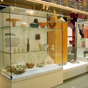 Museum Display Case Cabinet, displaying a number of items.