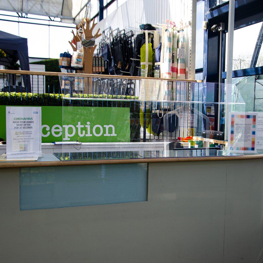 A Hygienic Food and Sneeze screen on a reception counter.