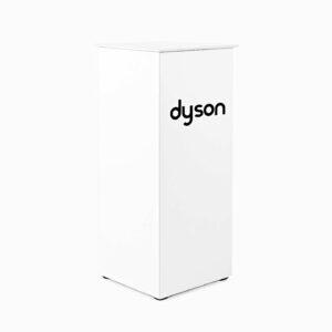 A white flat pack aluminium and acrylic plinth with dyson branding on the front.