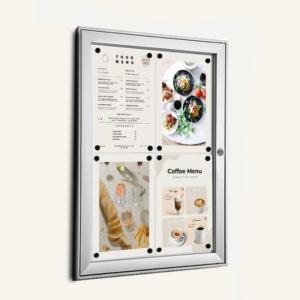A lockable notice board with menu information displayed on the front.