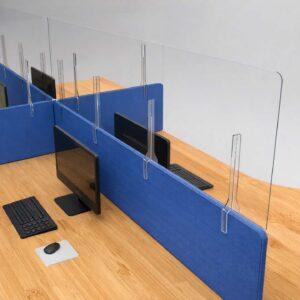 Clear acrylic desk dividers on an office desk.