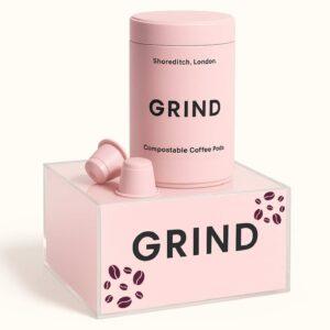 A pink grind countertop plinth with grind compostable coffee pods sat on top.
