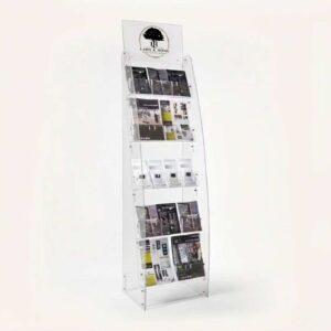 A 5 tier magazine and brochure rack with a header and brochures on display.