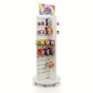 A slatwall pos display with custom branded header, castor wheels and toys and sweets on display.