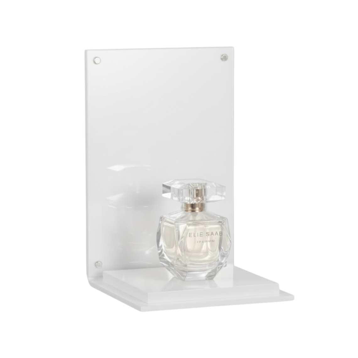 A white perfume display stand with a white platform and a perfume on display.