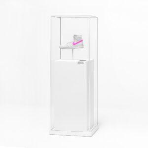 A minimalist retail display featuring a Nike trainer suspended inside a crystal-clear acrylic showcase. This premium product feature plinth highlights the shoe’s design while offering a sleek, modern presentation — perfect for branded retail environments, exhibitions, and visual merchandising displays.