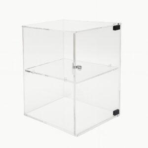 Clear acrylic display cabinet with a hinged door and internal shelf, photographed against a plain white background.