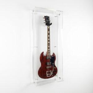Wall-mounted clear acrylic guitar display case holding an electric guitar, shown at a slight angle against a white background.