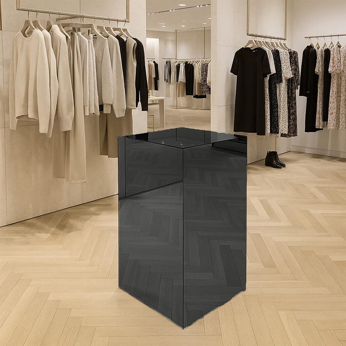 A smoked grey coloured mirror acrylic in a clothes shop.