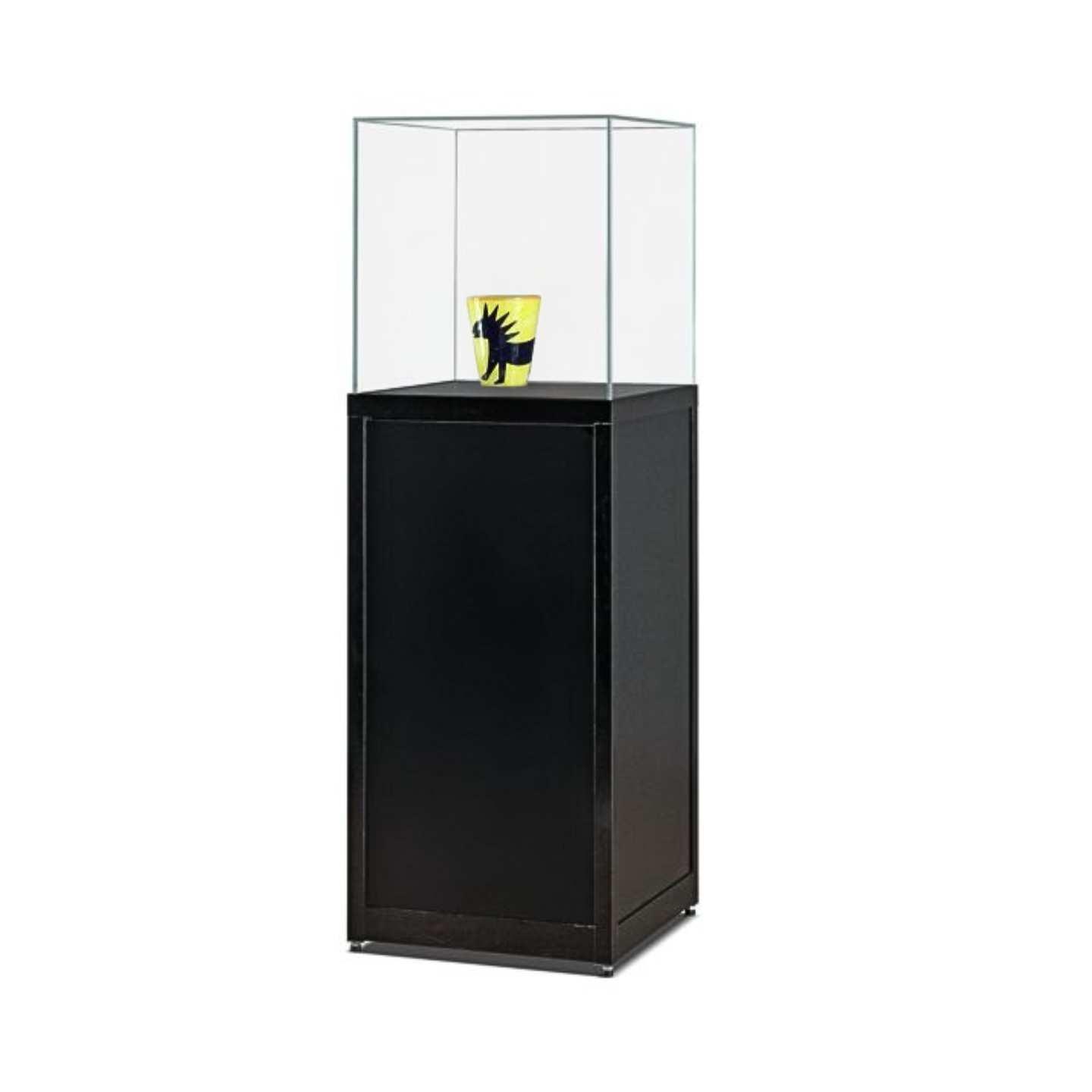 A black glass display case plinth with a vase on display.