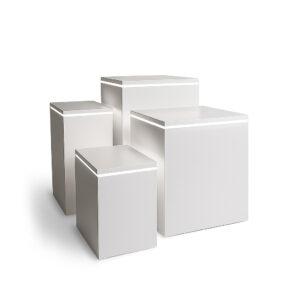 Collection of five white satin display plinths featuring subtle LED illumination around the top edges, presented in a soft-lit studio environment.
