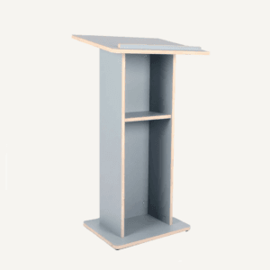 Modern wooden lectern with grey finish and exposed plywood edges, featuring a large reading surface and two inner shelves for storage.