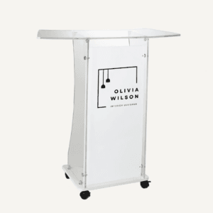 White corporate lectern with black castor wheels, with "olivia wilson interior designer" logo on the front.