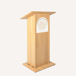 A wooden flat pack lectern facing the front right corner with a white logo saying "arrowwai industries".