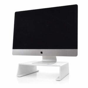 A white monitor stand with an Imac sitting on top.