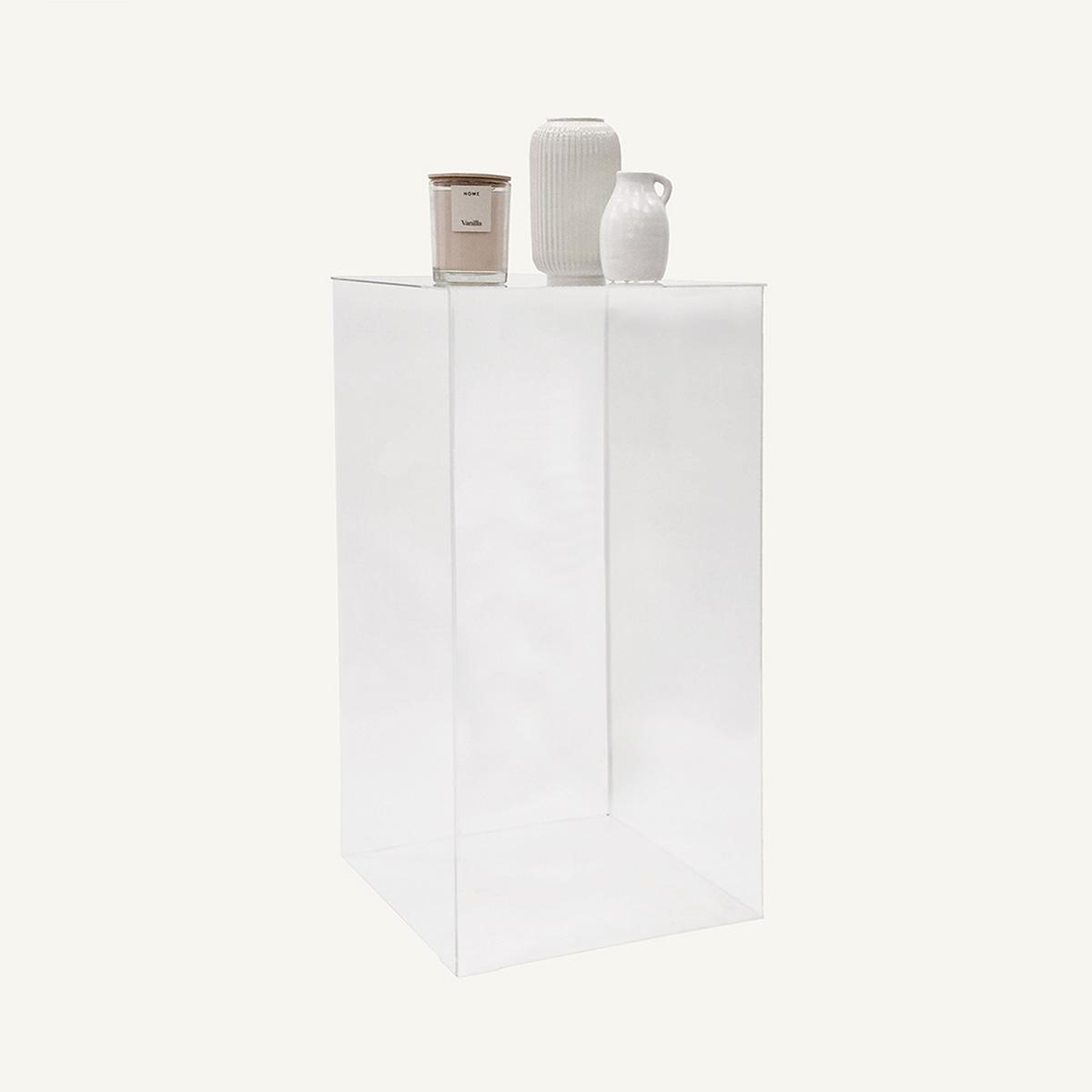 Clear Acrylic Plinth with vase and candles on display.