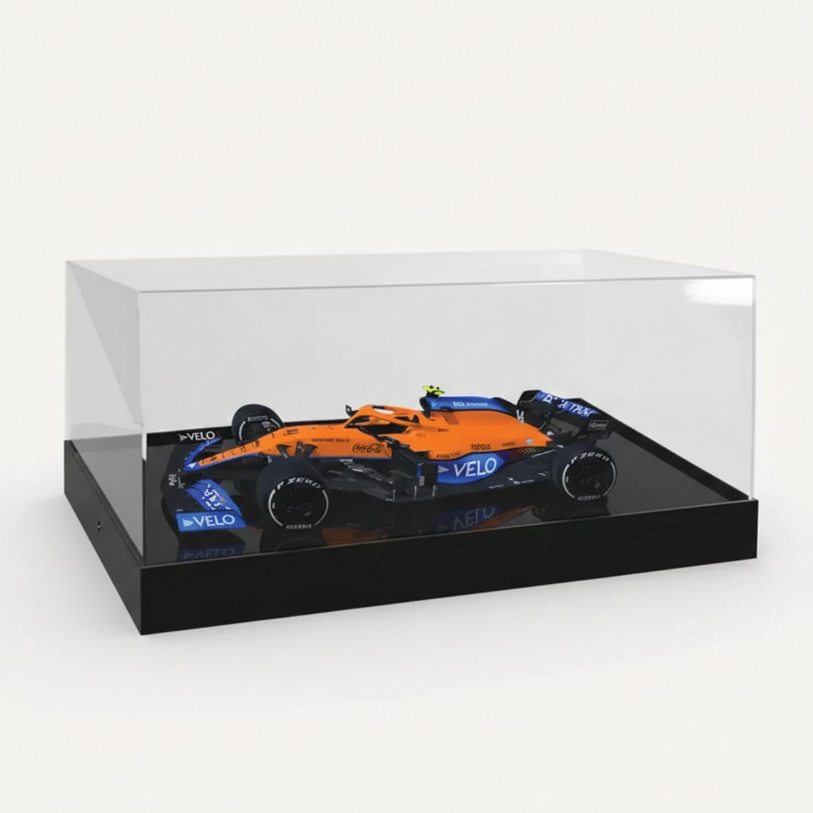 A 1:18 McLaren F1 Model Car Display with a black base and a F1 model car on display.