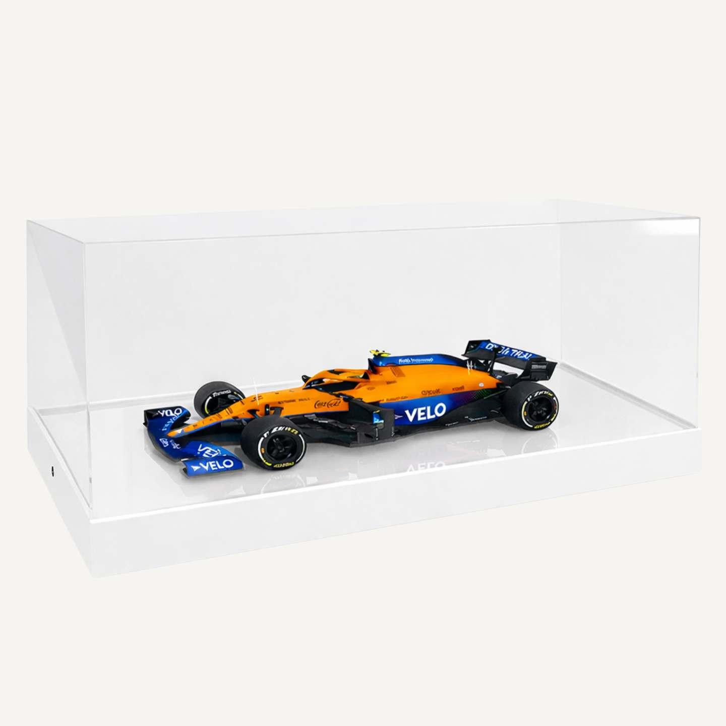A 1:8 McLaren F1 Model Car Display Case with a white base and a model car on display.