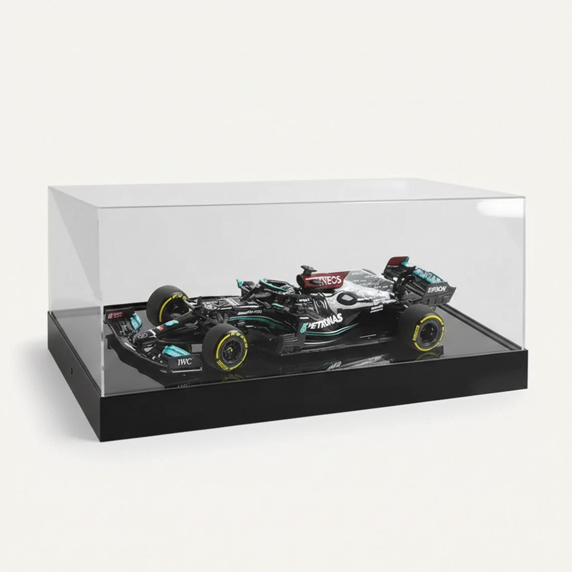 A 1:18 Mercedes F1 Model Car Display with a black base and a model car on display.
