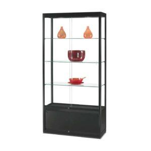 A black cabinet with sliding doors and ornaments inside.