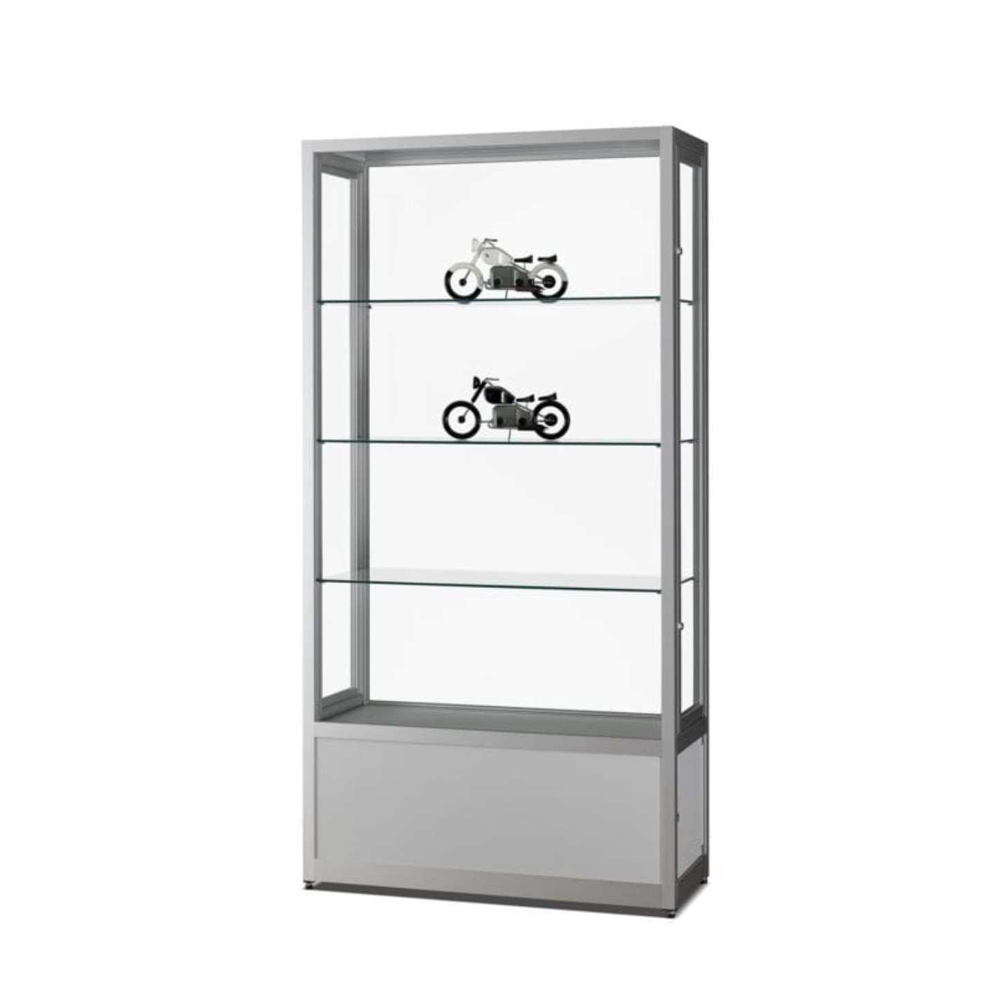 A silver display cabinet with storage, 4 shelves and two motorbikes on display.
