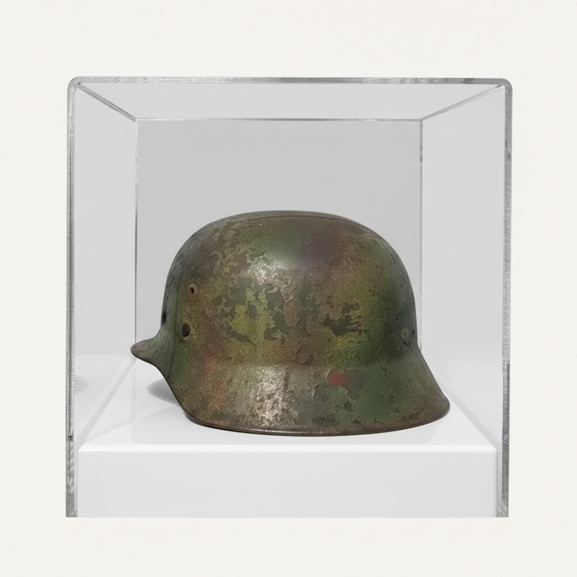 A display case with a white base, a clear acrylic lid and a historical helmet on display.