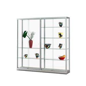 A silver display case with sliding doors, shelves and different vases on display.
