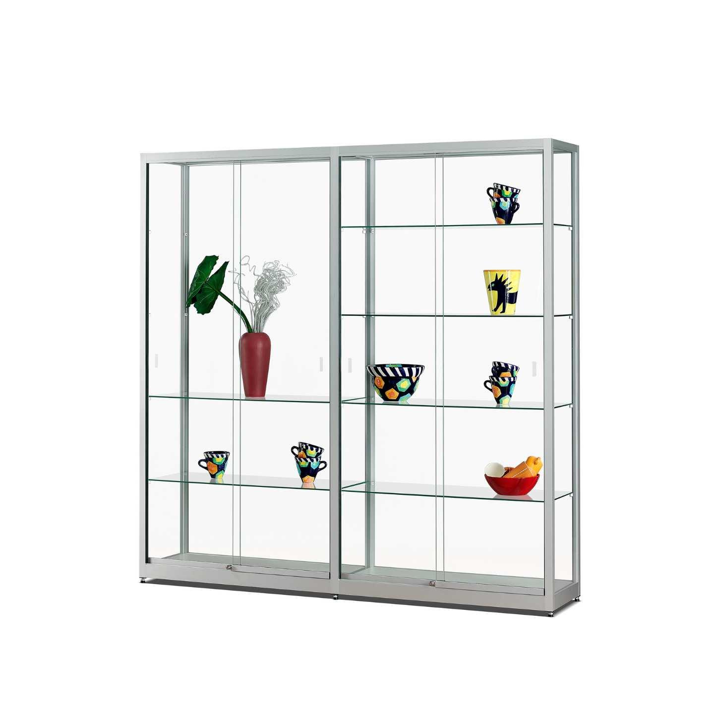 A silver display case with sliding doors, shelves and different vases on display.