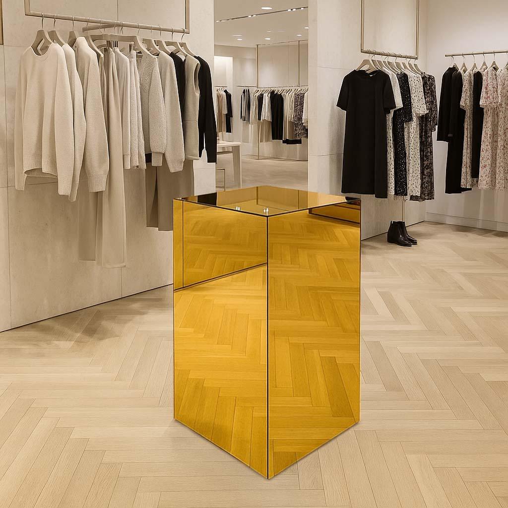 Gold Mirror Plinth In a retail shop display.