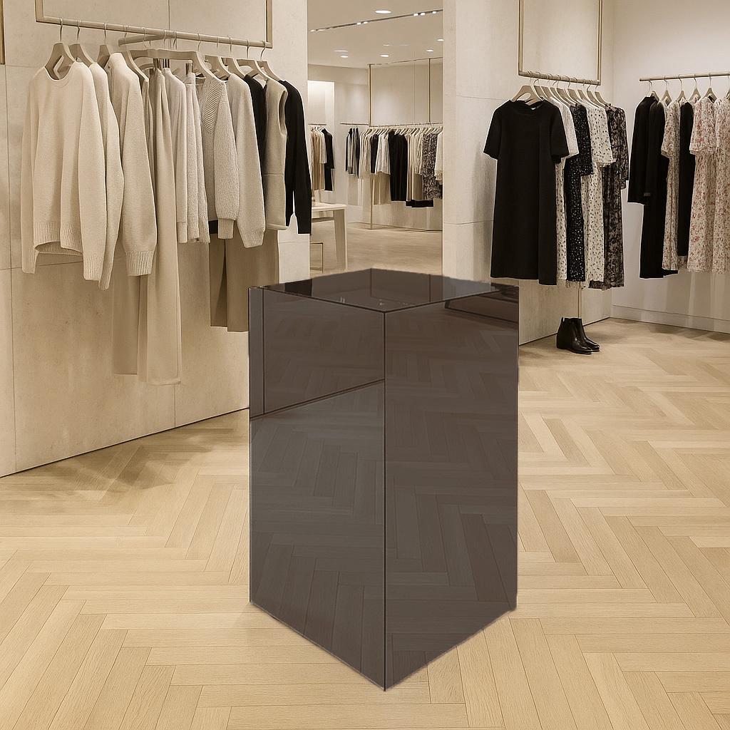A light bronze coloured mirror acrylic in a clothes shop.