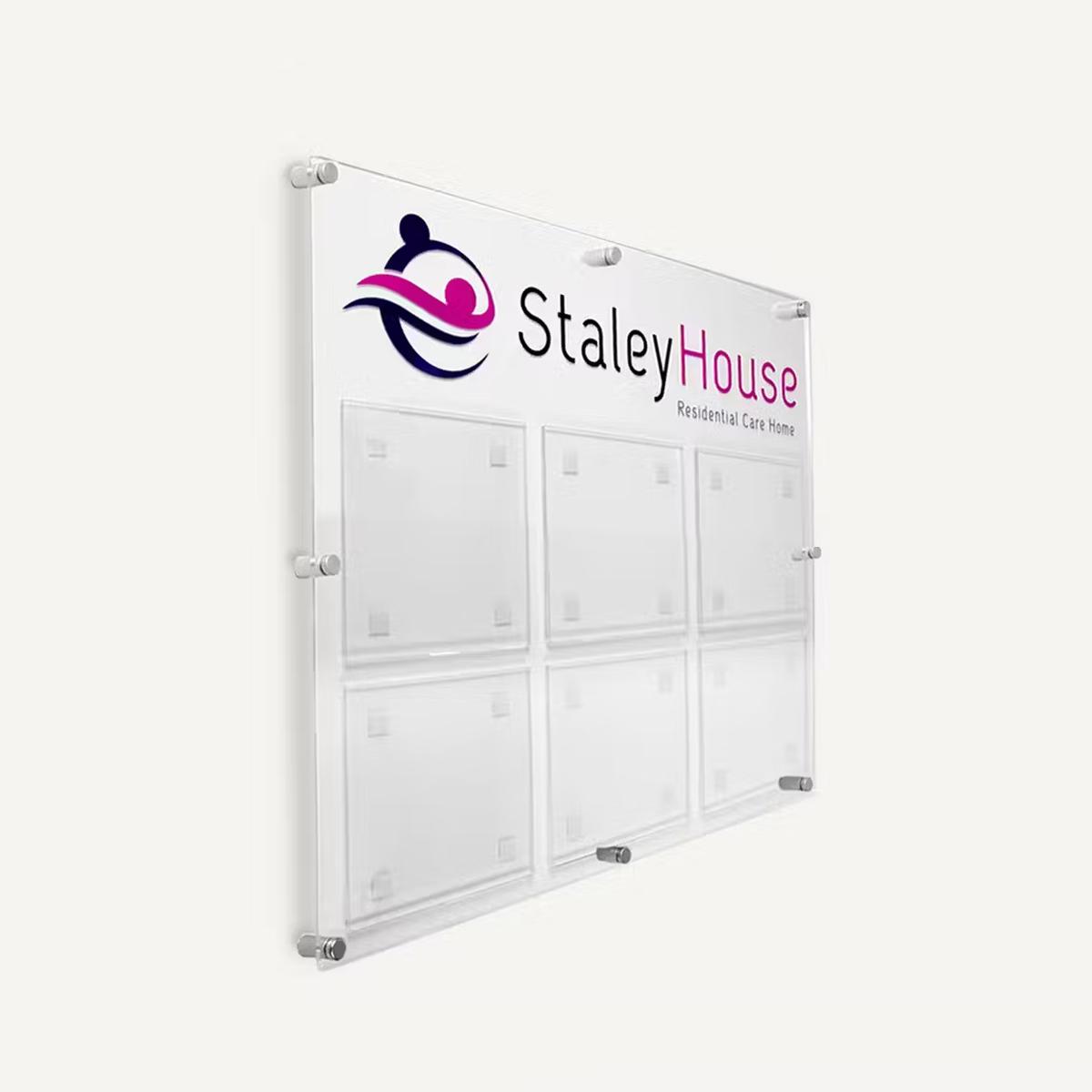 6 A4 Landscape pocket clear Acrylic wallboard with branding.
