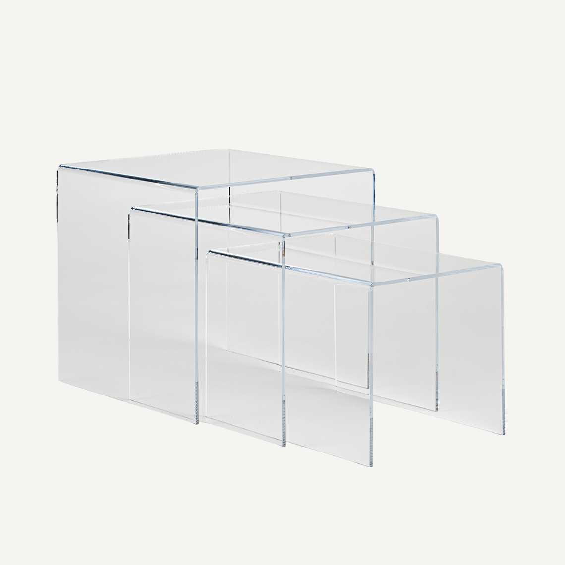 Acrylic nest of three tables pulled out.