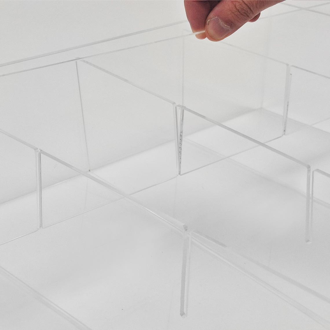 A close up of a custom acrylic storage box facing left with the slats being removed.