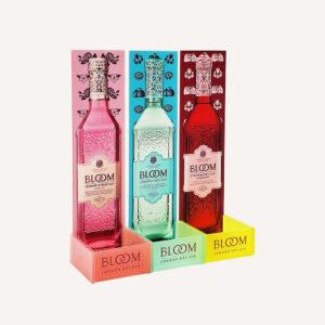 Three colourful Bloom gin bottle pos cards: pink Jasmine & Rose, blue London Dry, and red Strawberry Liqueur in colourful display boxes.
