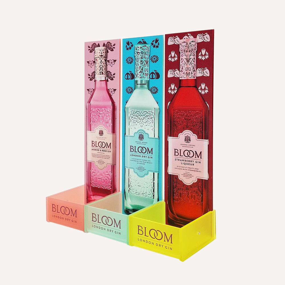 Colourful Bloom gin bottle point of sale display merchandiser facing the left.