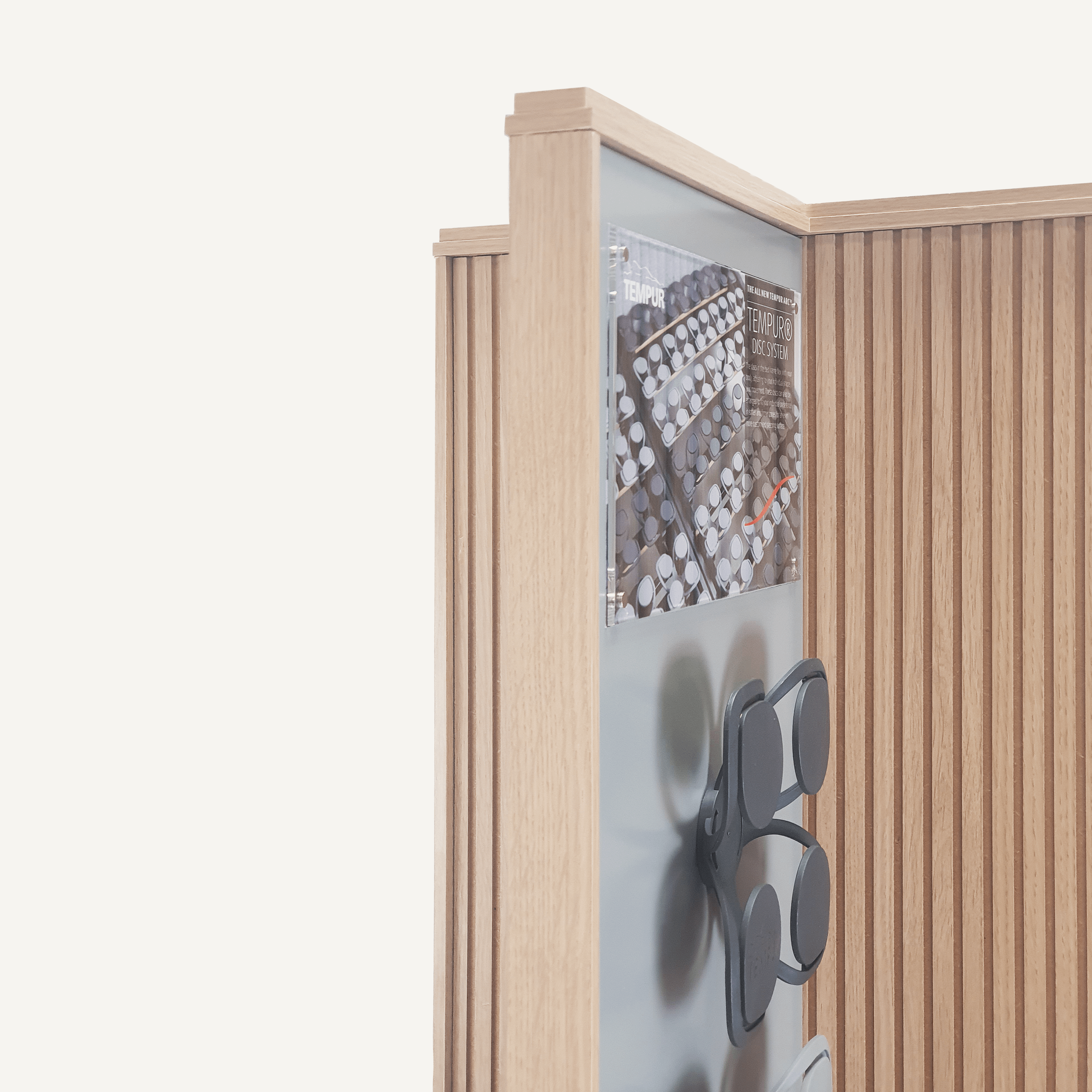 A close up of the top of a rotating POS display with Tempur samples on display.