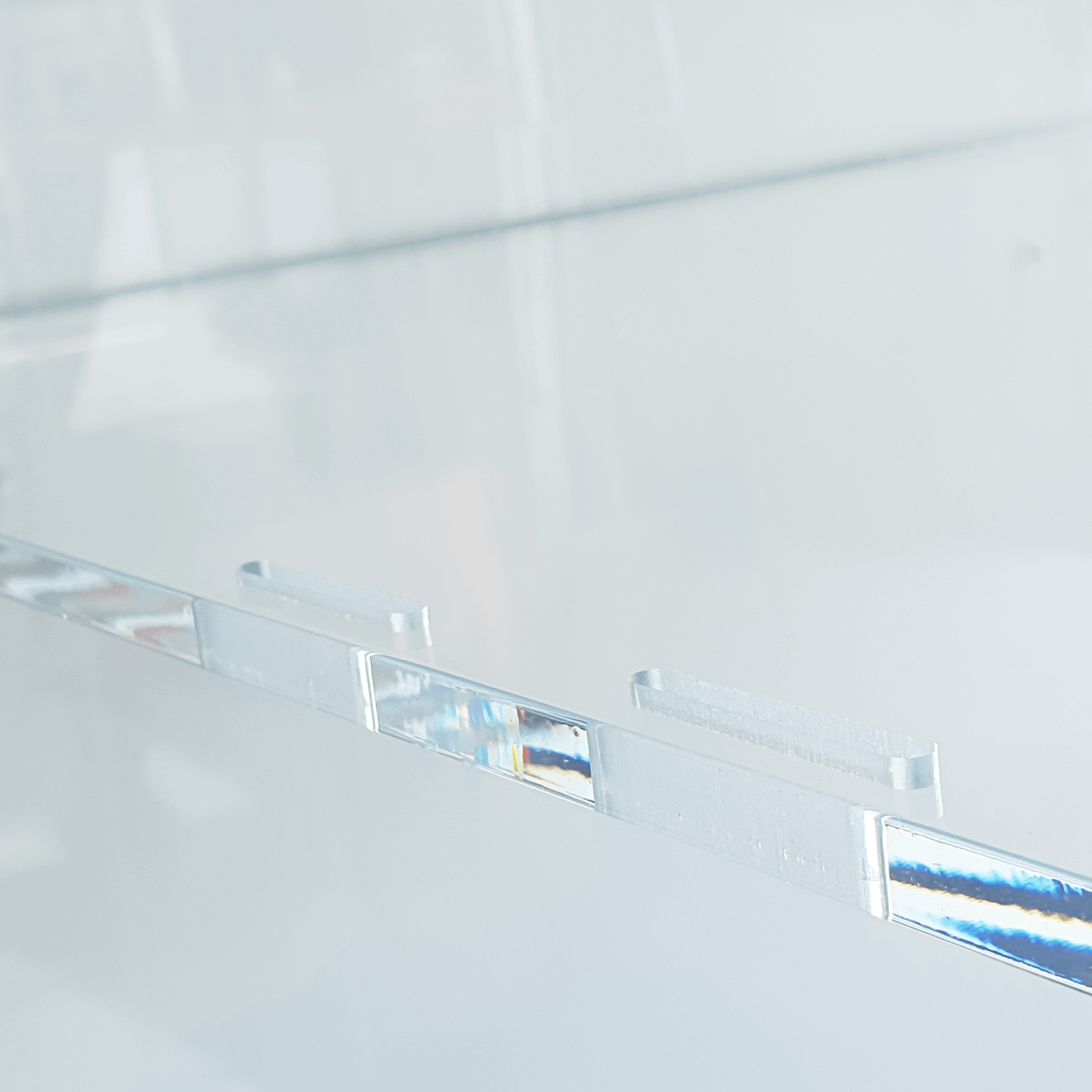 A close up of removeable acrylic panels for an acrylic display case.
