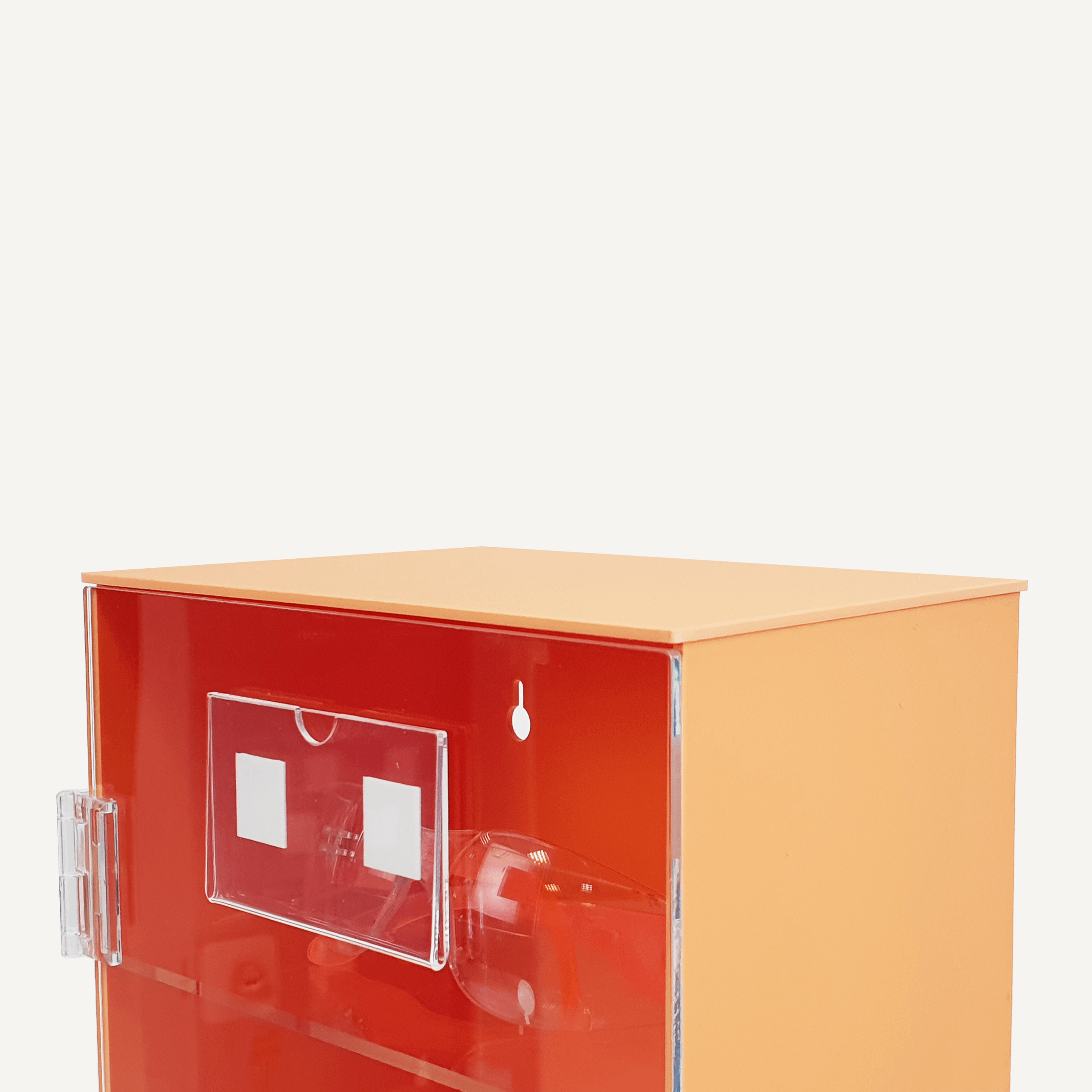 A close up of an orange and clear acrylic PPE storage cabinet with label pocket.