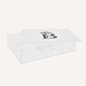 A Custom Acrylic Storage Box laid flat with is lid off, and a banana split logo on the front.