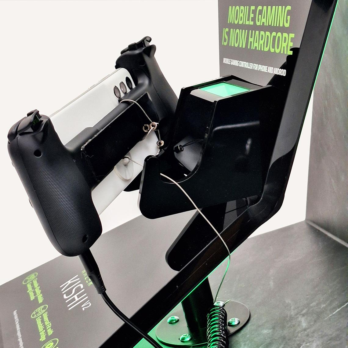 Close up of the Razer Kishi V2 mobile gaming controller handle with a smartphone.