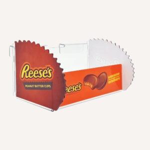 A side view of a Reese's peanut butter cup retail product display.