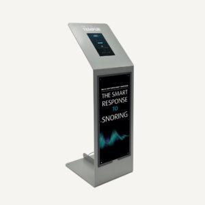 A digital silent salesman information kiosk with a small, digital screen at the top and Tempur branding on the front.