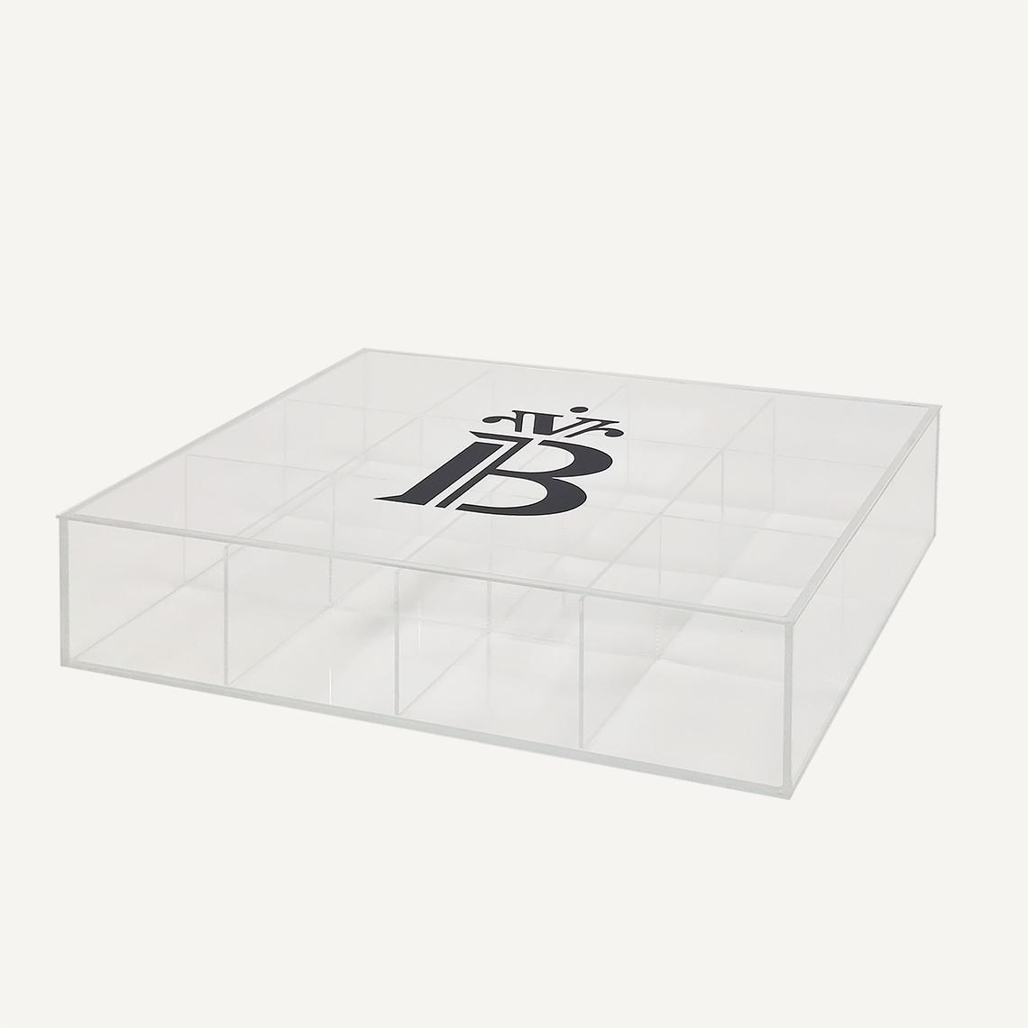 A custom acrylic storage box facing left. laid flat with a banana split logo on the front.