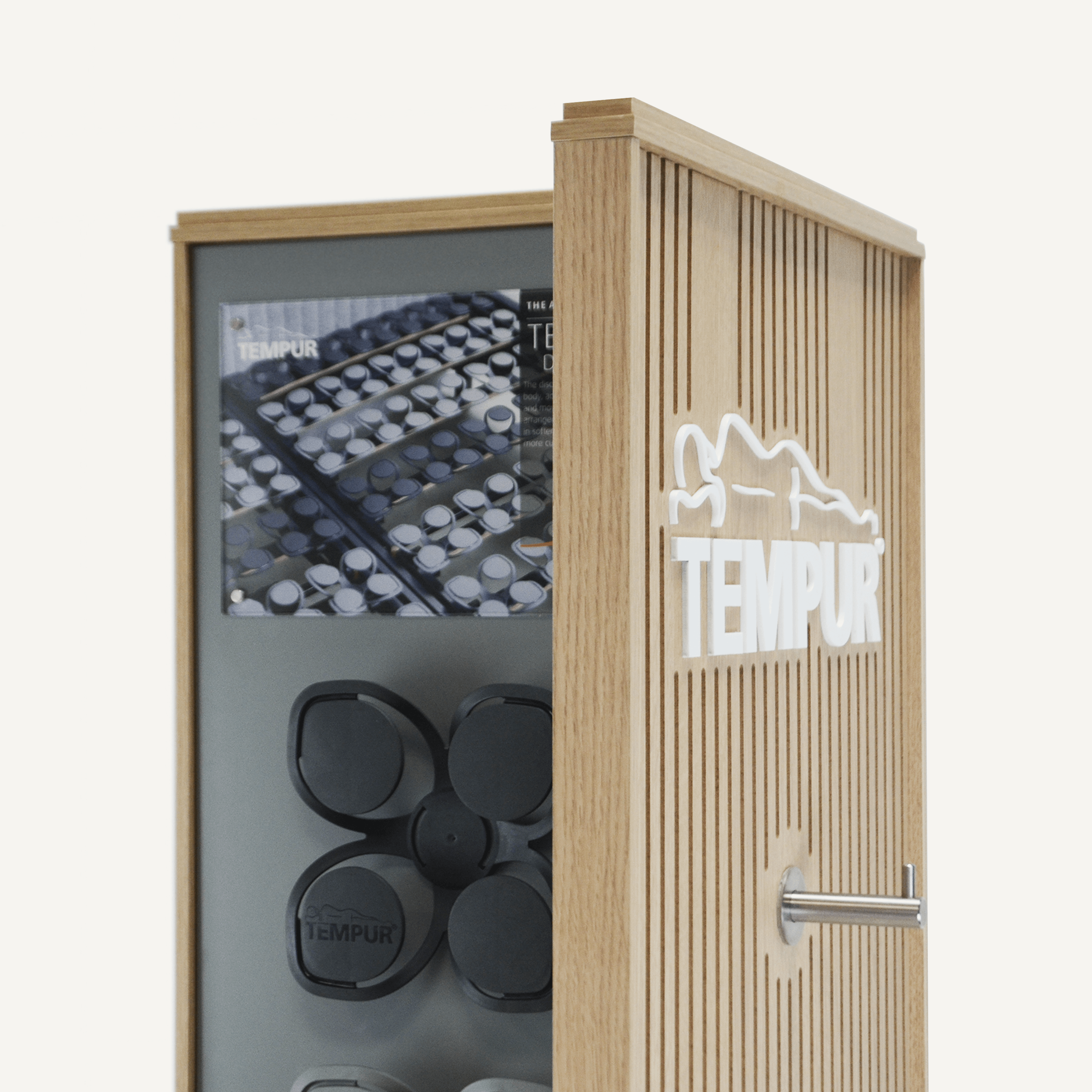 A close up of a rotating POS display with a 3D Tempur acrylic logo and chrome hook with samples on the panel behind.