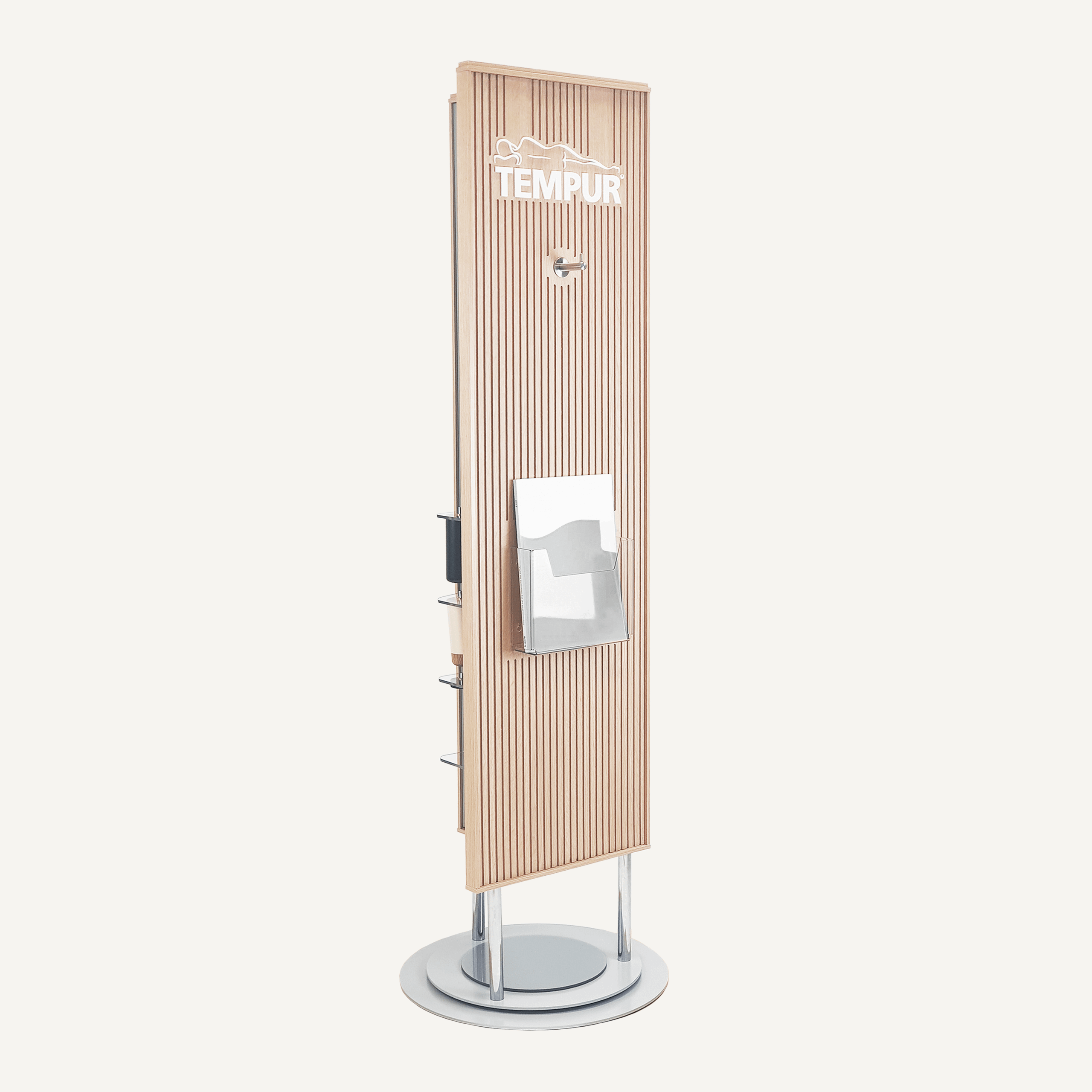 A left facing rotating POS display with a chrome base and plywood finish. It features an acrylic brochure holder, Tempur logo and chrome hook on the front.