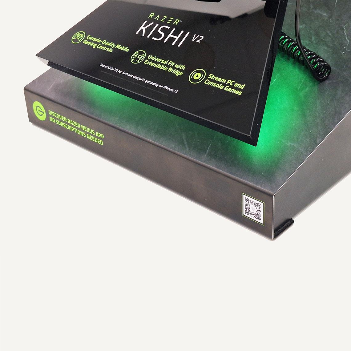 A close up of the Razer Kishi V2 gaming console display stand featuring its QR code in the bottom left hand corner of the display.