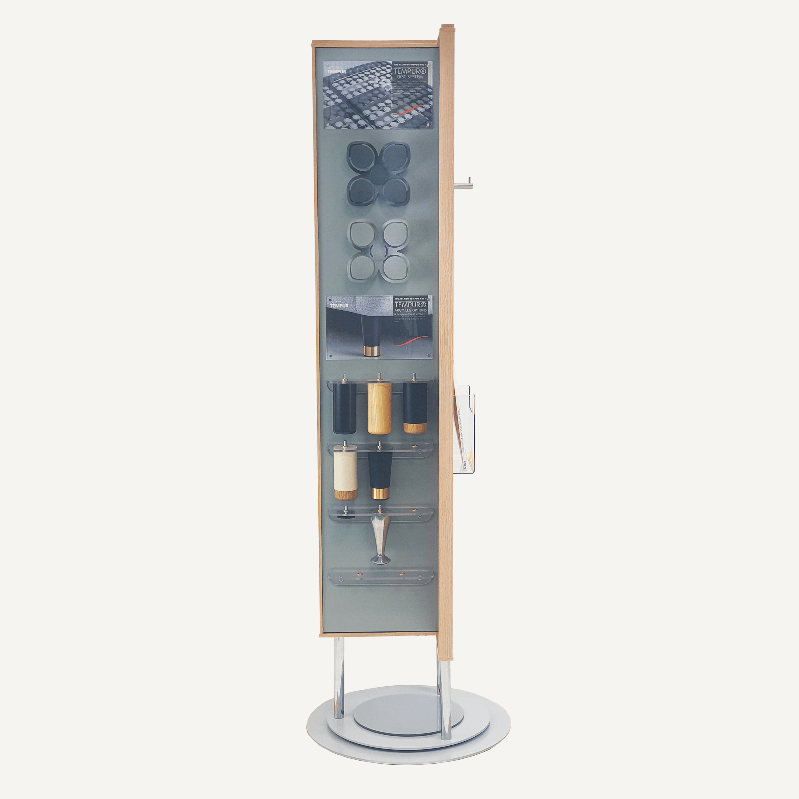 A rotating POS display with Tempur samples inside facing the front.