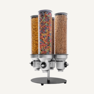 A silver countertop rotating cereal dispenser with different cereals.